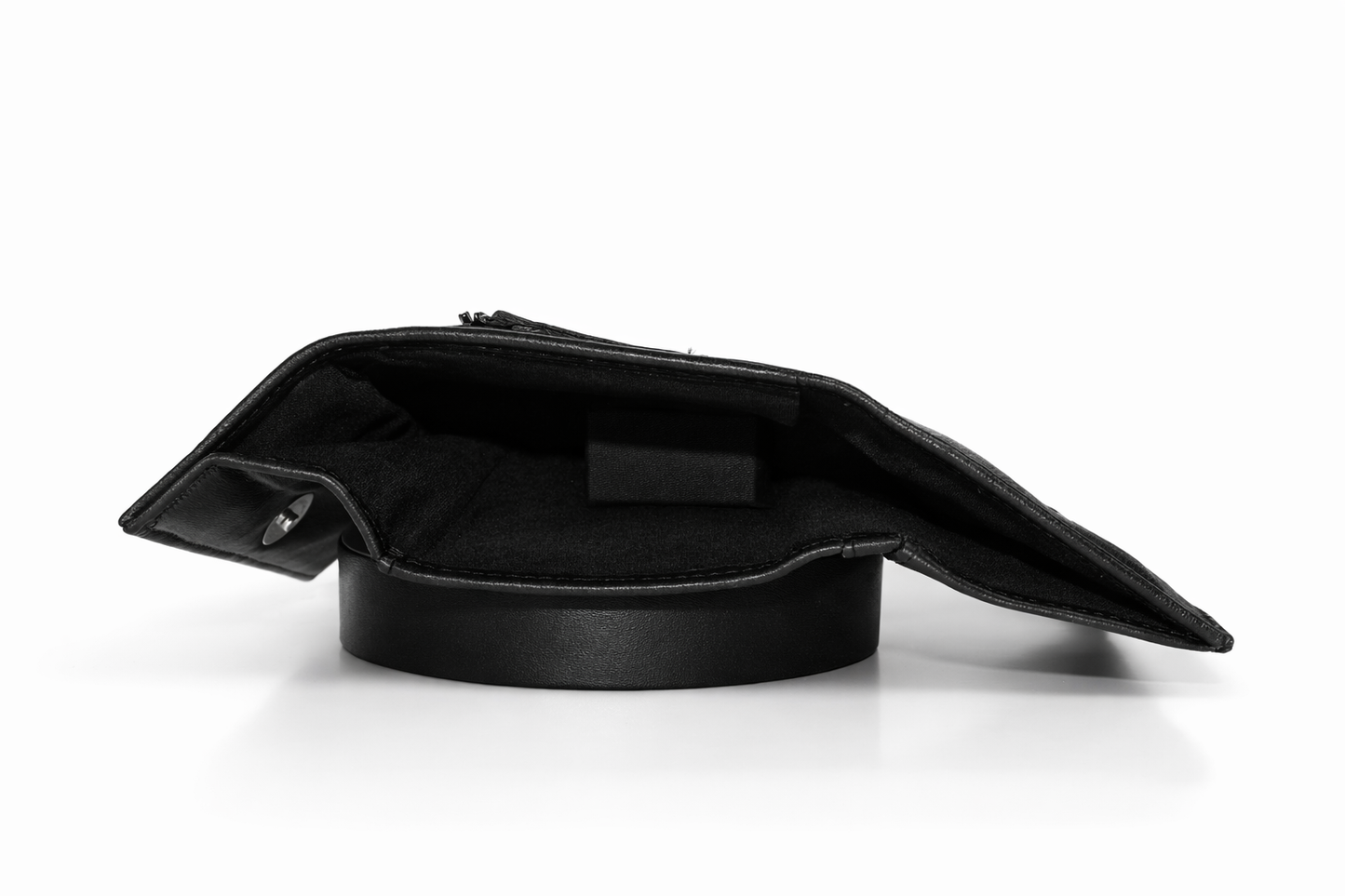 Premium Aricio Mag grande black leather wallet displayed on a white surface highlighting its sleek design and leather texture