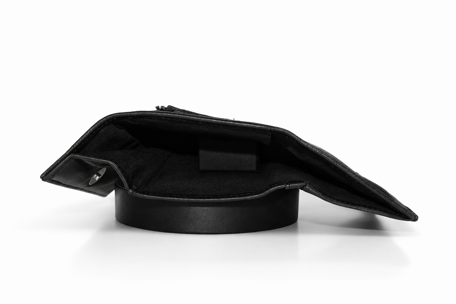 Premium Aricio Mag grande black leather wallet displayed on a white surface highlighting its sleek design and leather texture